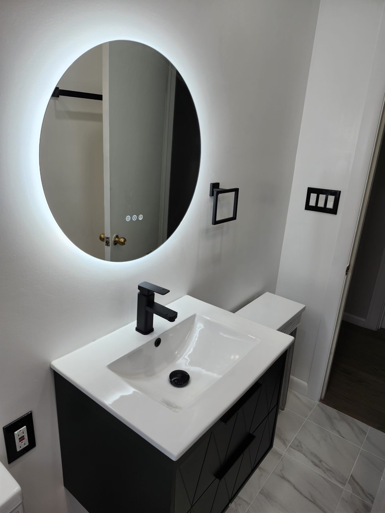Illuminated mirror and vanity
