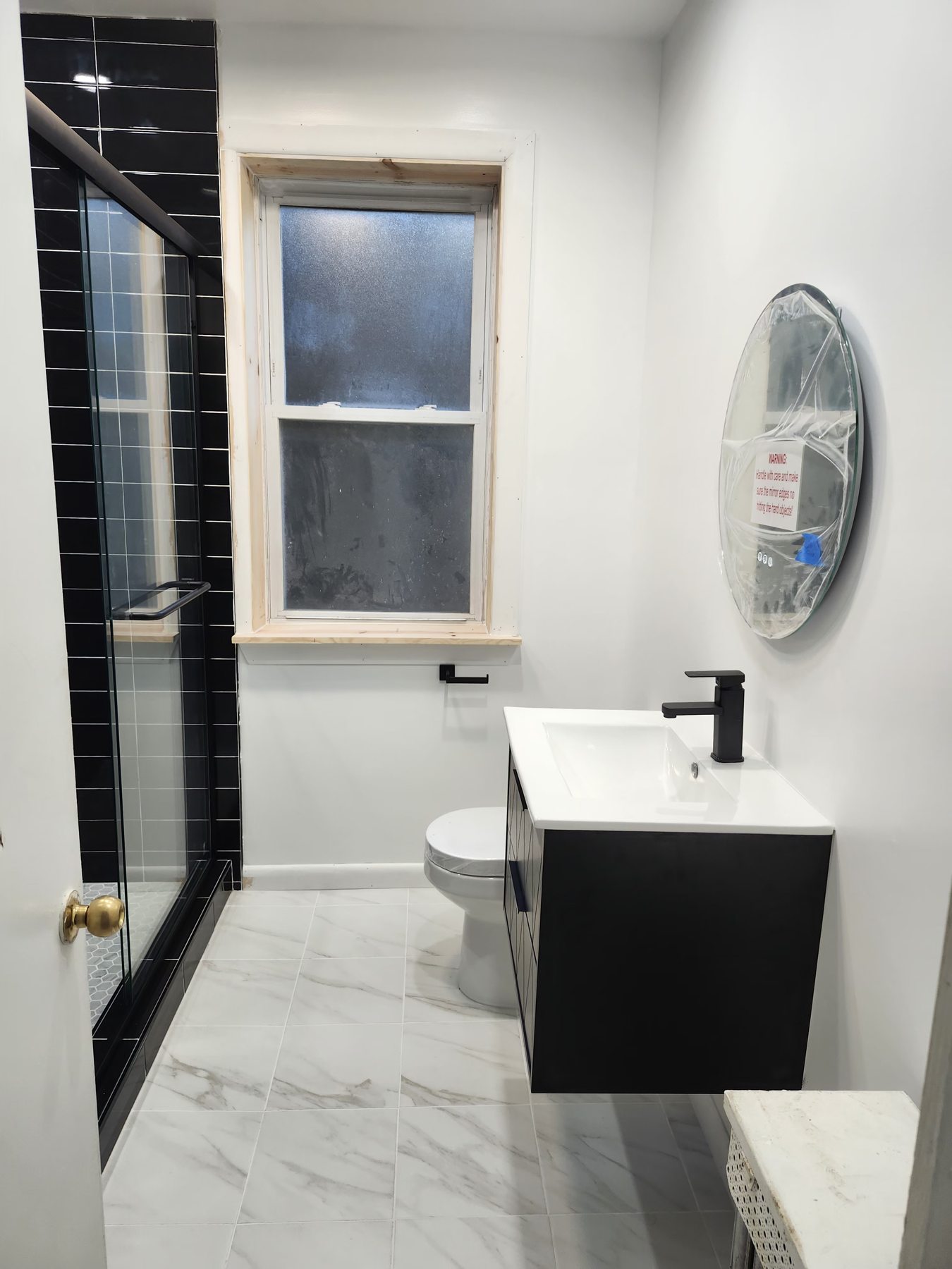Finished vanity and glass shower