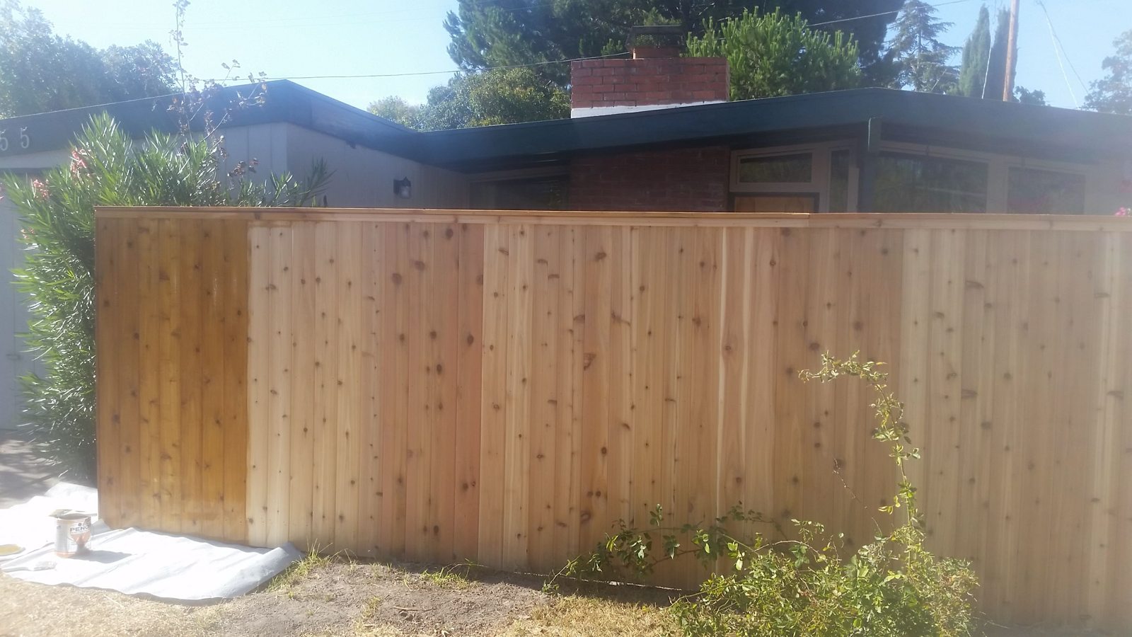 Wood privacy fence beside a home