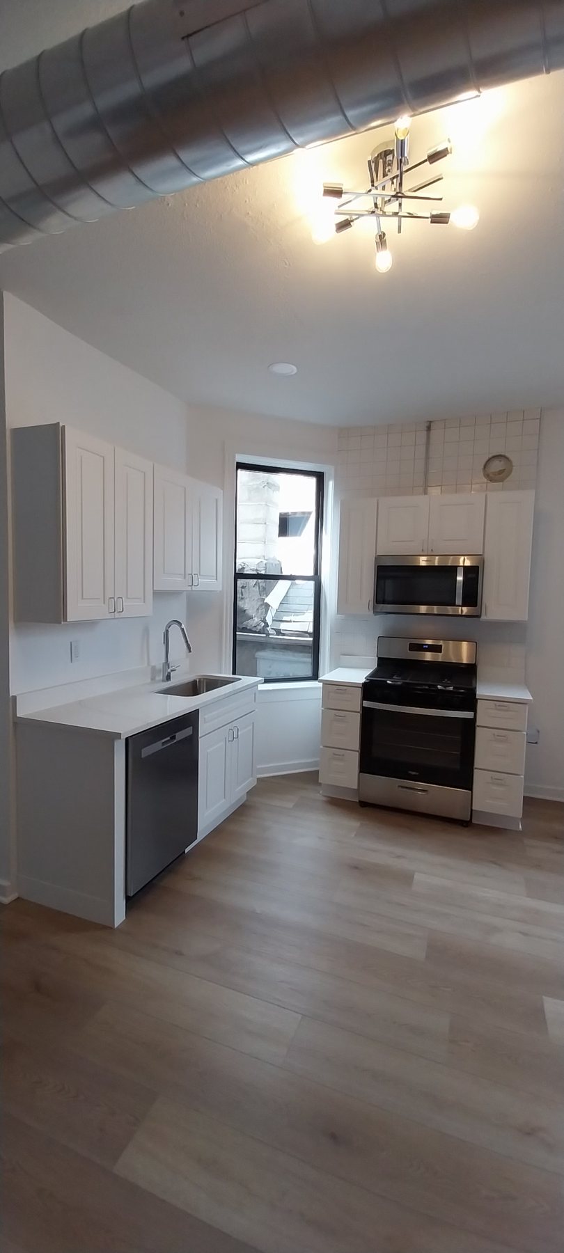 Completed kitchen with white cabinets